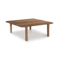 A contemporary design Copeland Furniture Sierra Square Coffee Table made of North American hardwood with four legs on a white background.