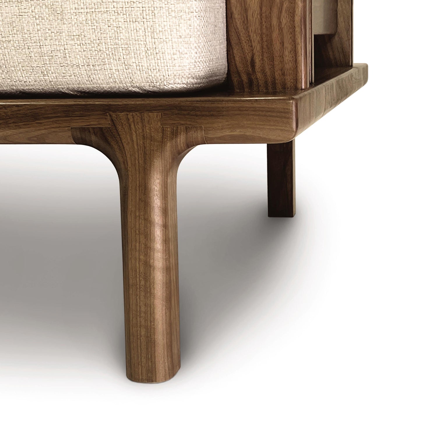 Copeland Furniture wooden bed frame with smooth, rounded legs and a beige mattress showcasing minimalist design.