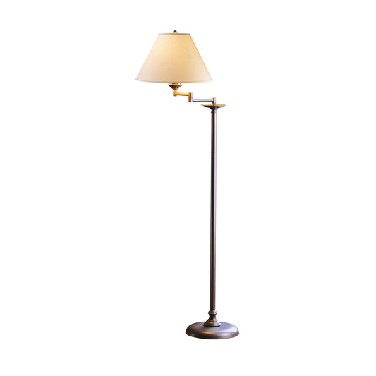 A Simple Lines Swing Arm Floor Lamp with a beige shade on a white background becomes:
A Hubbardton Forge Simple Lines with Swing Arm Floor Lamp with a beige shade on a white background.