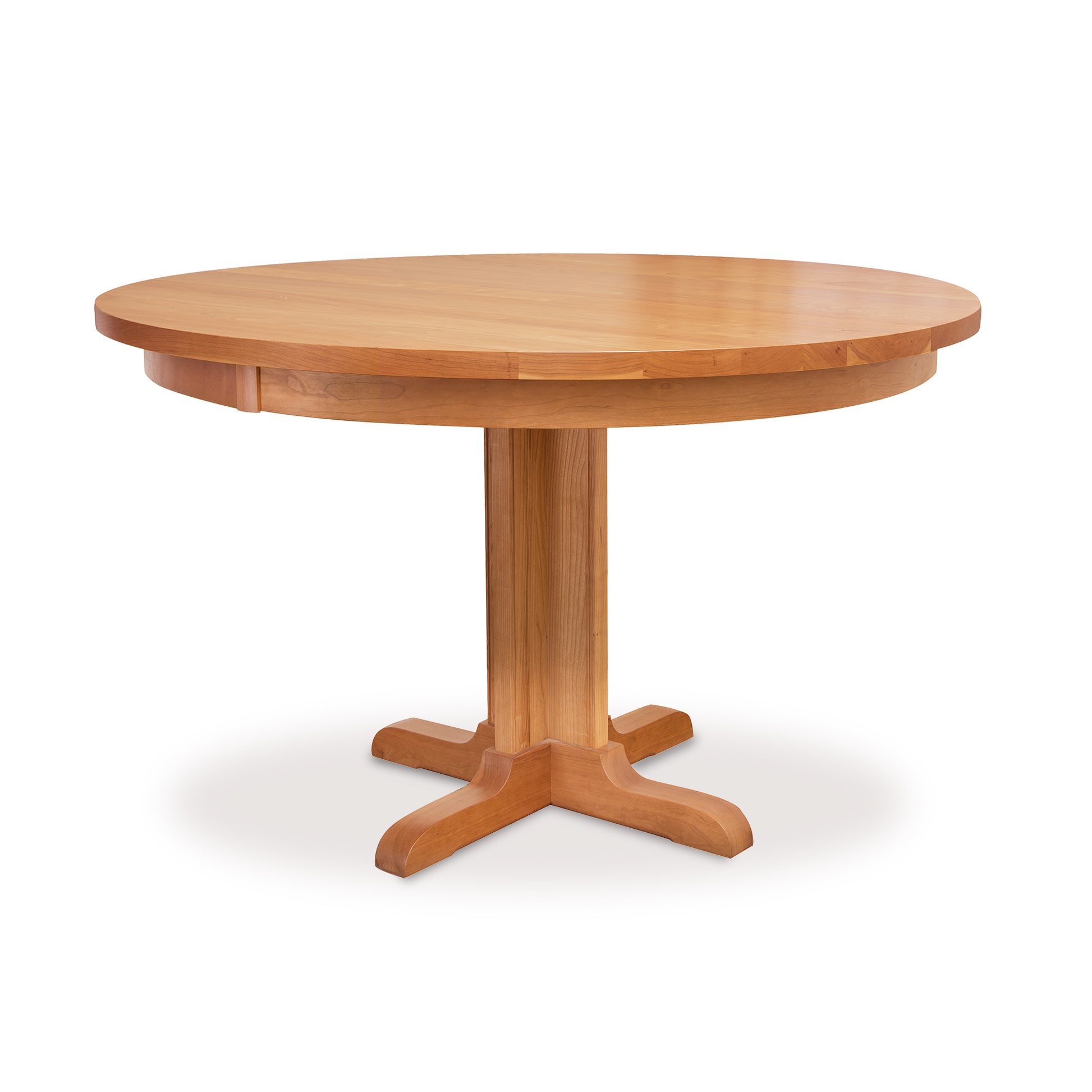 A sturdy, Lyndon Furniture single-leg round pedestal table with a wooden base.