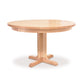 A sturdy Single - Leg Round Pedestal Table with a solid wooden base by Lyndon Furniture.