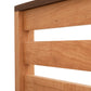 Close-up of a solid Vermont Furniture Designs Skyline Panel Bed showcasing the detail of the headboard slats and corner joint.