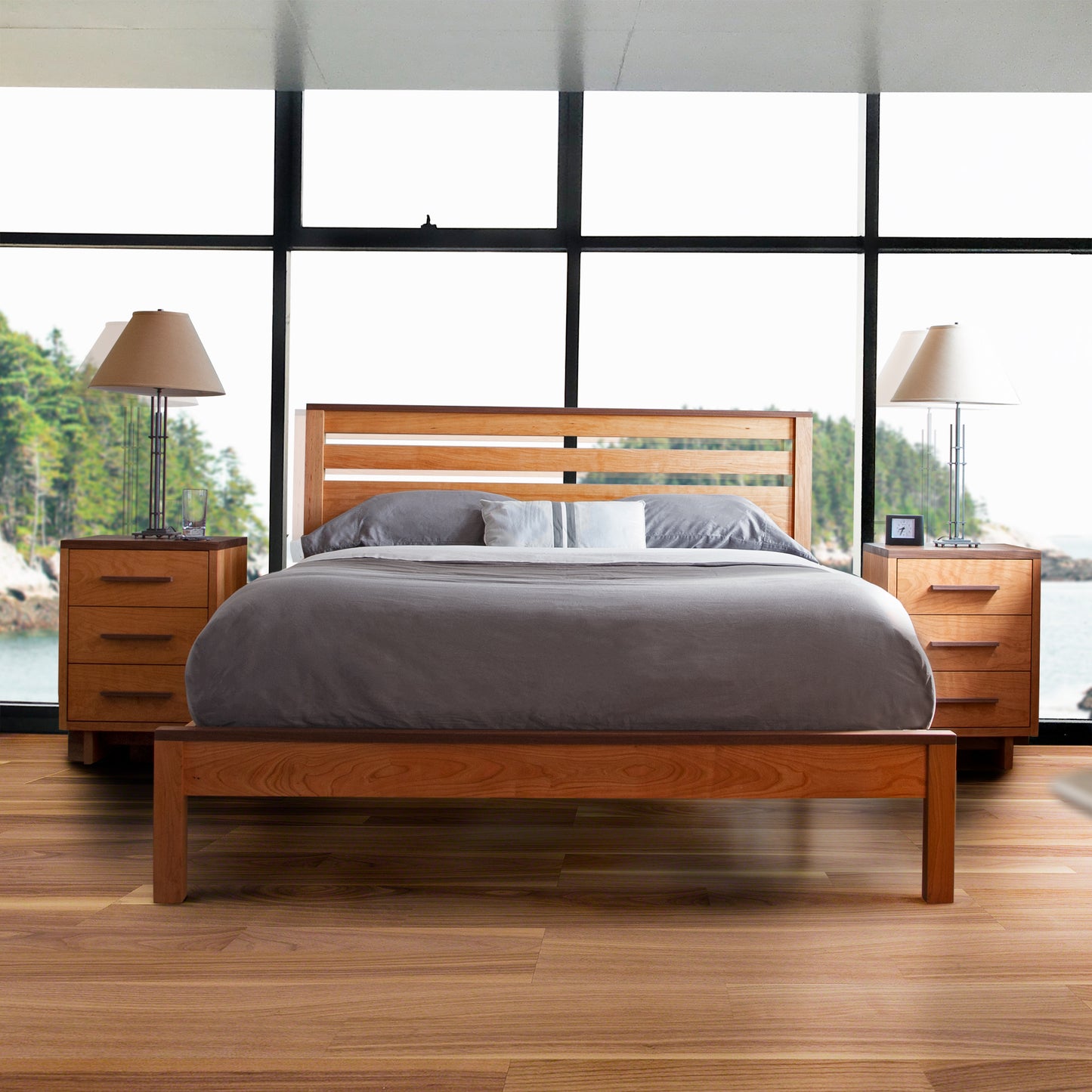 Skyline Panel Bed by Vermont Furniture Designs with gray bedding and wooden nightstands.