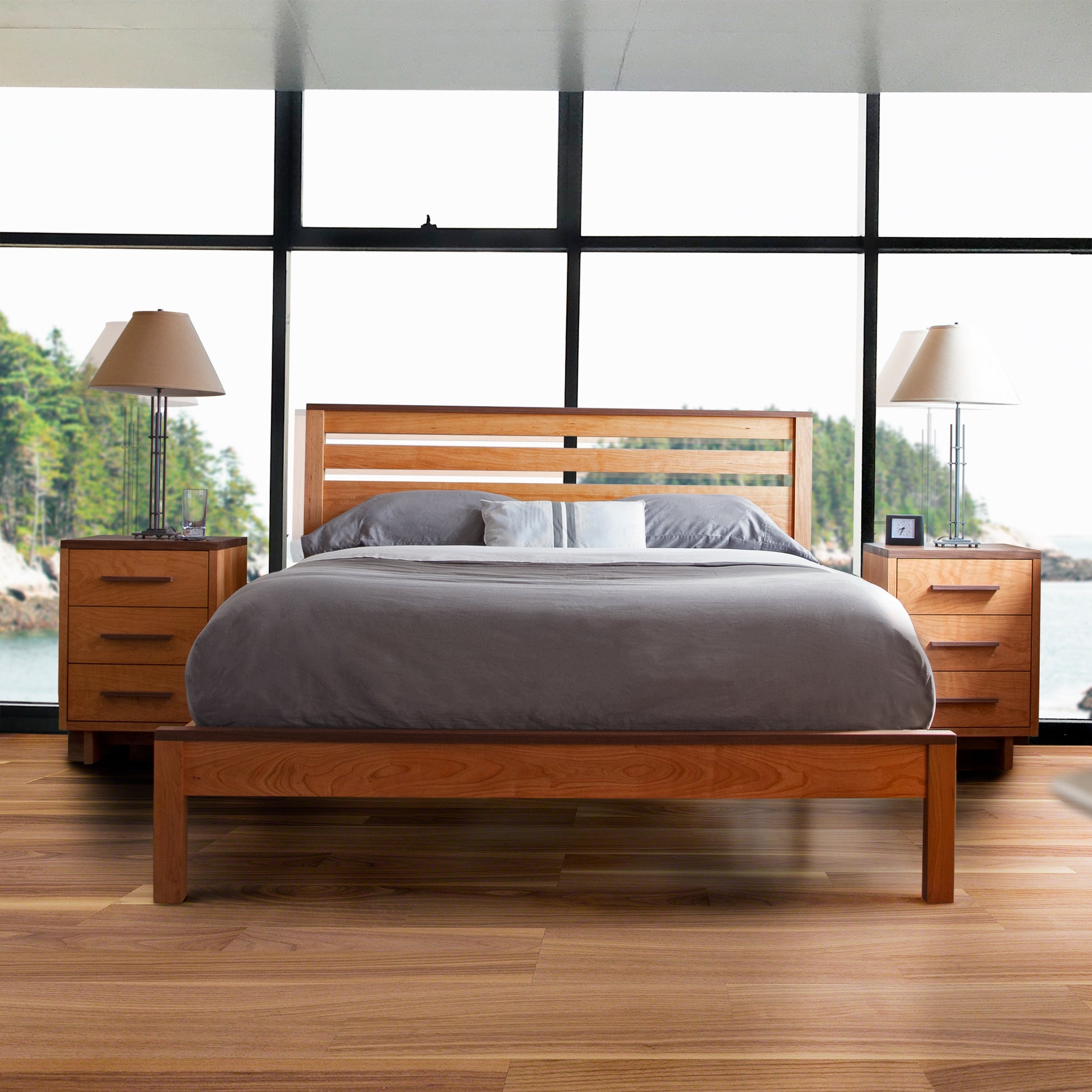 Skyline Panel Bed by Vermont Furniture Designs with gray bedding and wooden nightstands.
