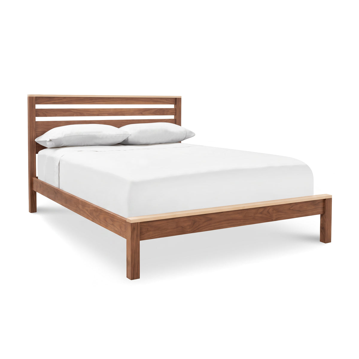 Skyline Panel Bed with slatted headboard and eco-friendly hand-rubbed oil finish by Vermont Furniture Designs, adorned with white bedding.