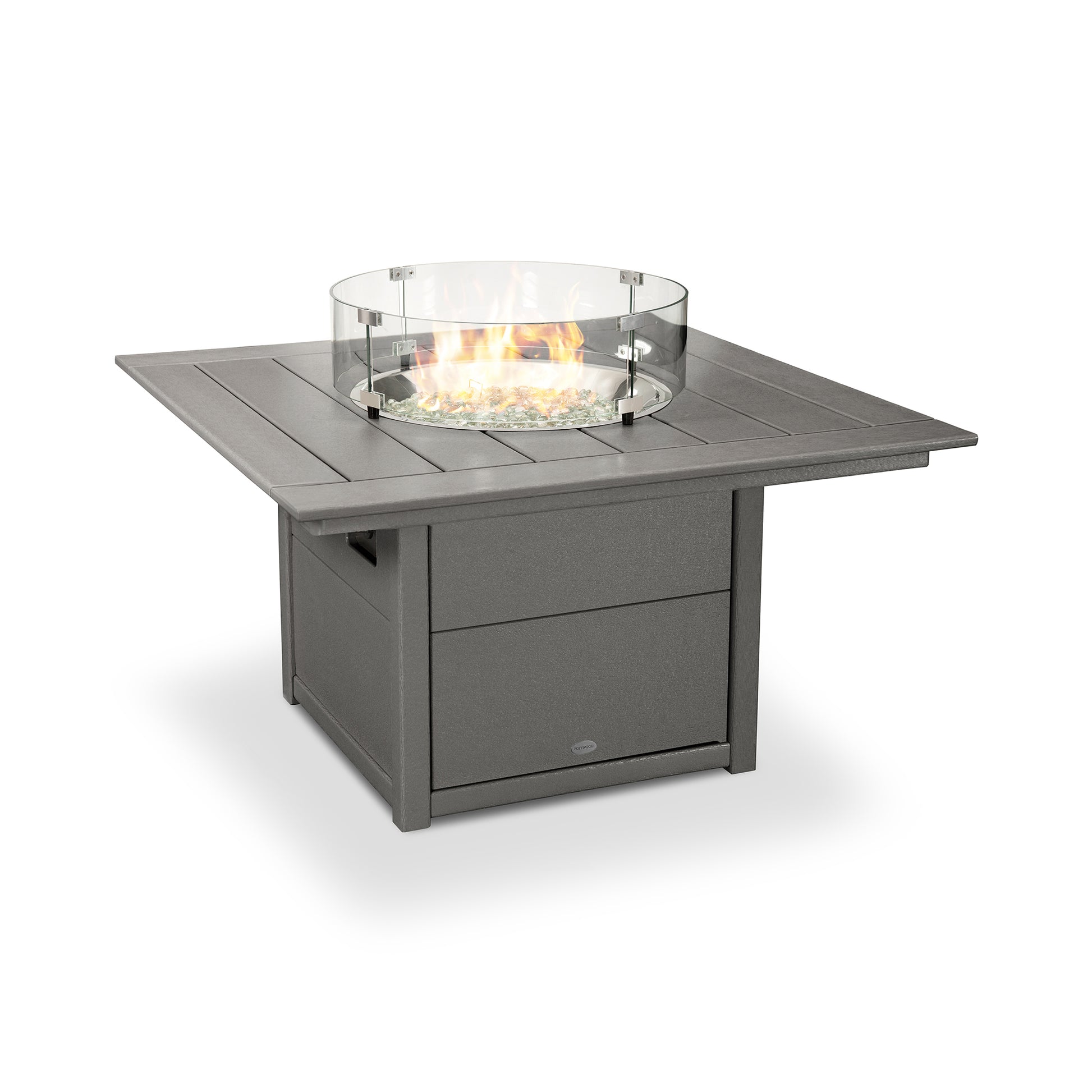 A square POLYWOOD Square 42" Fire Pit Table with a glass wind guard, set against a white background. The table is constructed from grey paneled metal, featuring centralized flames and a lower shelf for storage.