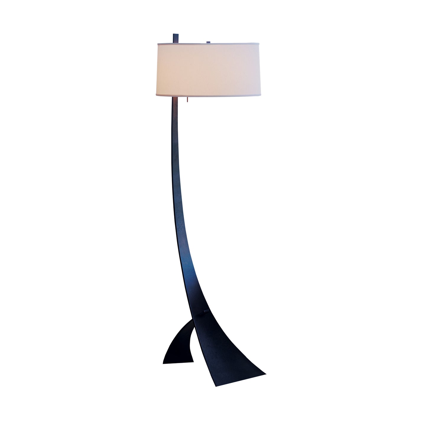 Stasis Floor Lamp by Hubbardton Forge featuring a sleek hand-crafted curved black metal stand paired with a classic white cylindrical shade.