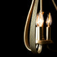 A Hubbardton Forge Sweeping Taper 3-Arm Chandelier with three candles in a timeless style and traditional design.