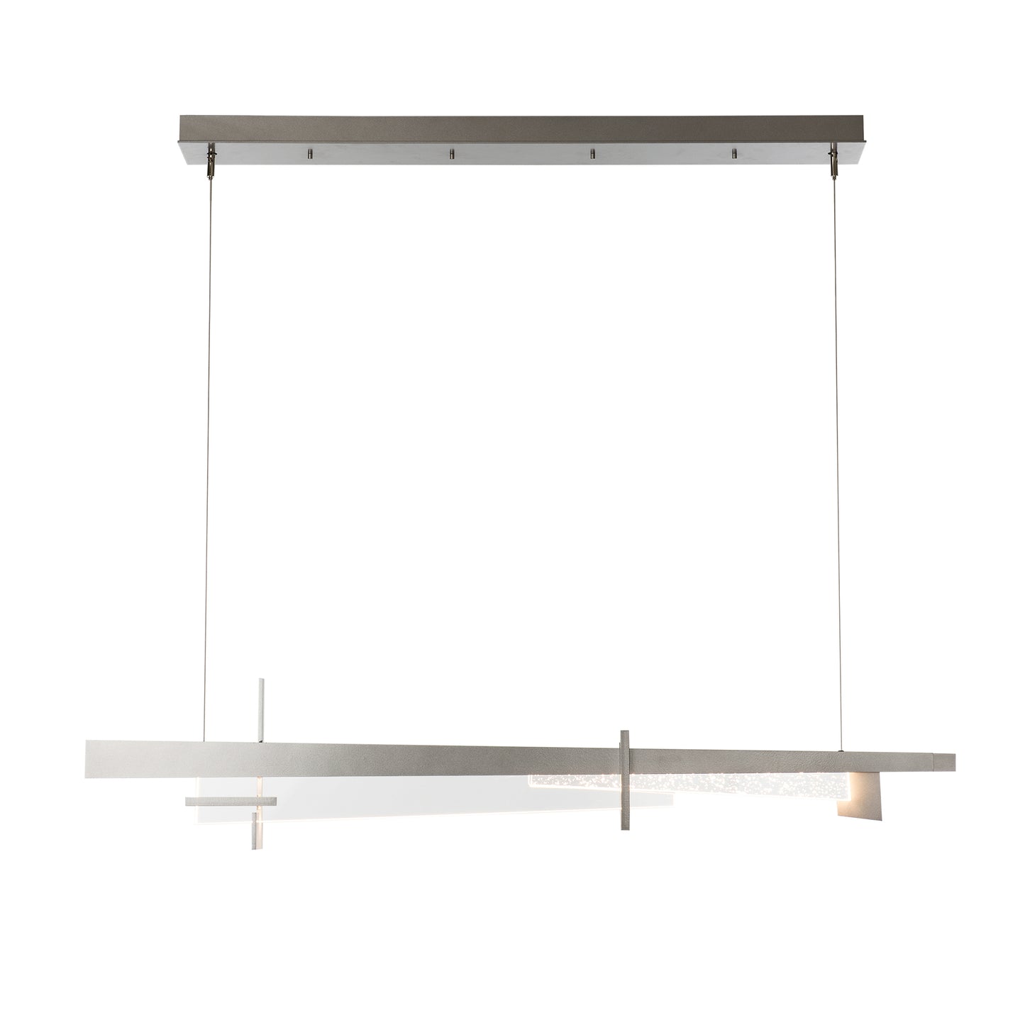 Modern linear Tenon LED Pendant by Hubbardton Forge, featuring brushed metal and geometric design, suspended by cables.