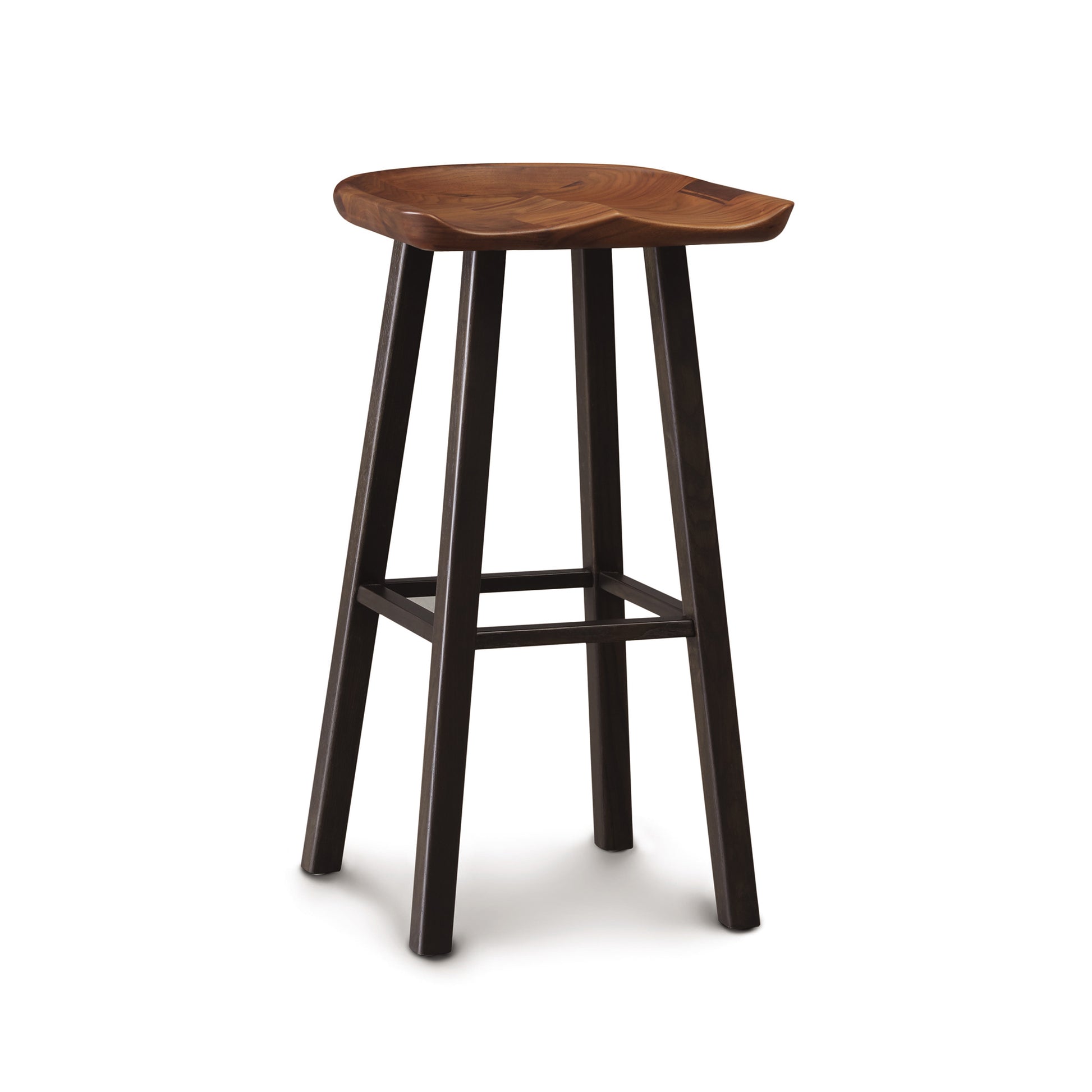 A Modern Farmhouse Tractor Bar Stool from Copeland Furniture with a contoured tractor seat and four seared oak wood legs, isolated on a white background.