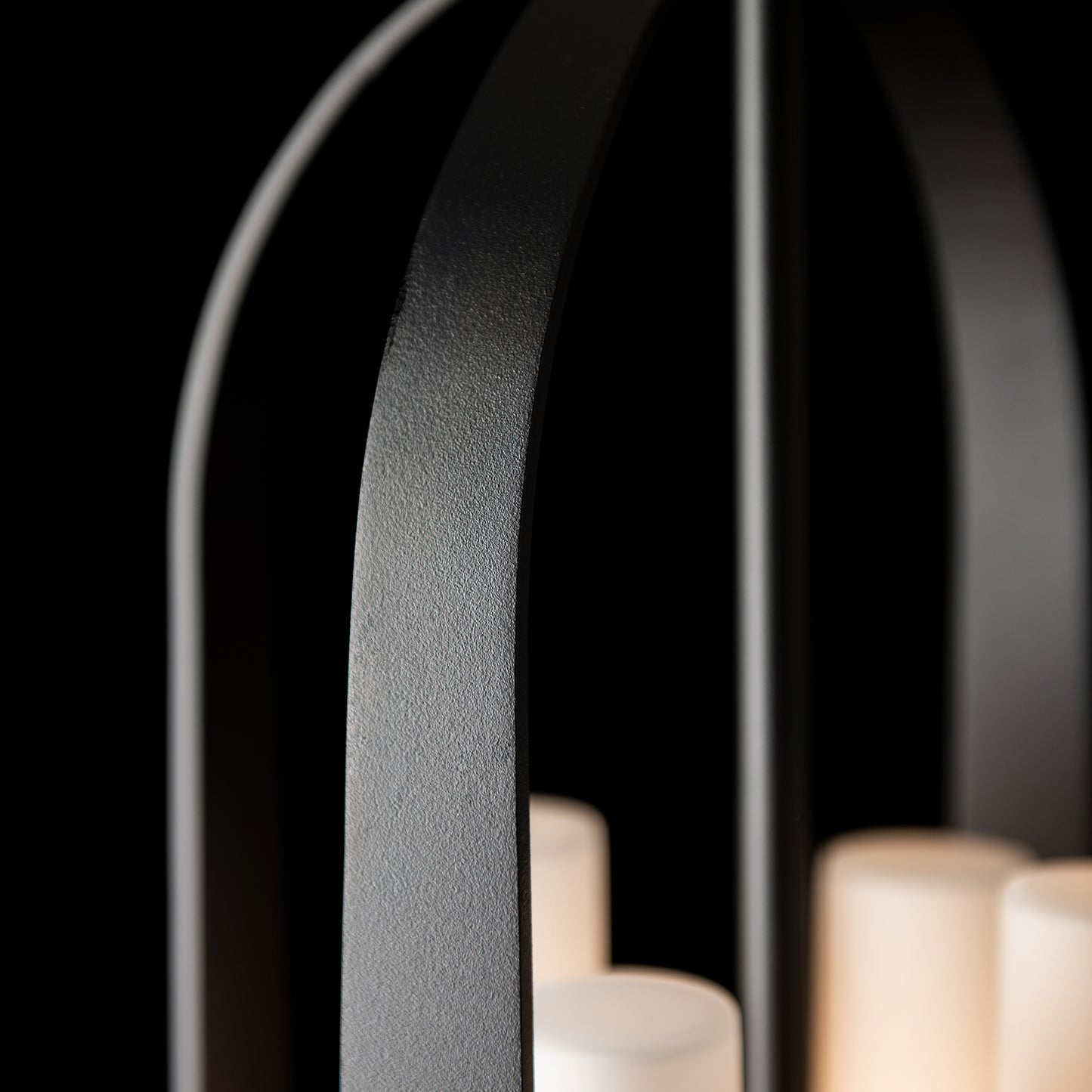 Hubbardton Forge Triomphe Outdoor Lantern in Coastal Black, featuring a sleek, modern design with clear glass panels and sturdy metal construction.