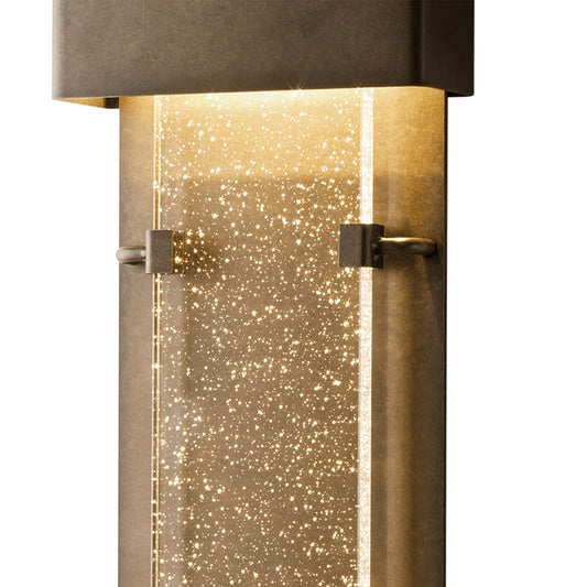 Ursa Large LED Outdoor Sconce by Hubbardton Forge featuring a sleek rectangular top and textured bubble-glass, highlighting quality craftsmanship.