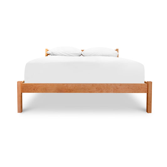 Vergennes Platform Bed - King by Vermont Furniture Designs: Eco-friendly wooden frame with natural finish, featuring a white mattress and pillows.