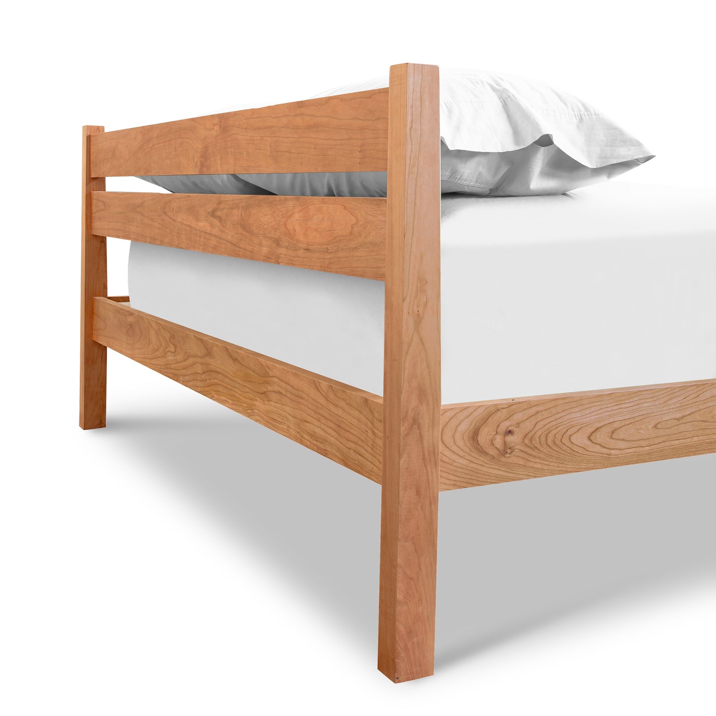 Vergennes Platform Bed by Vermont Furniture Designs crafted from eco-friendly hardwoods, showcasing its minimalist style with a white mattress and pillow.