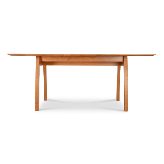 Lyndon Furniture Vermont Modern Extension Trestle Table in solid cherry, showcasing a sleek design.