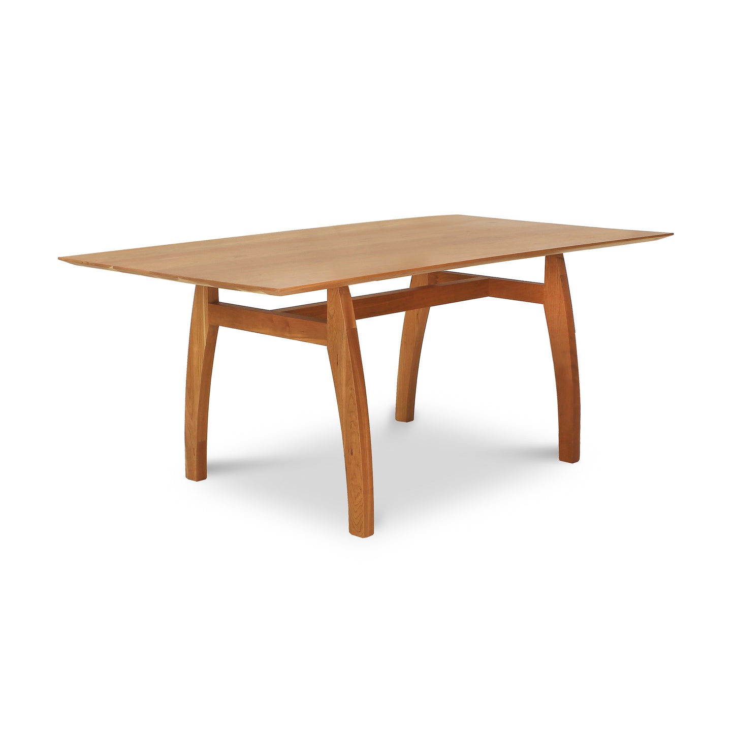 Vermont Modern Solid Top Trestle Table by Lyndon Furniture showcasing its smooth rectangular top and elegantly curved legs in solid wood craftsmanship.