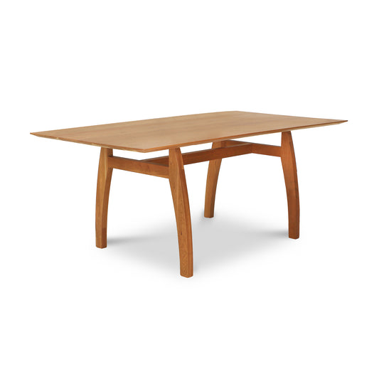 Vermont Modern Solid Top Trestle Table by Lyndon Furniture showcasing its smooth rectangular top and elegantly curved legs in solid wood craftsmanship.