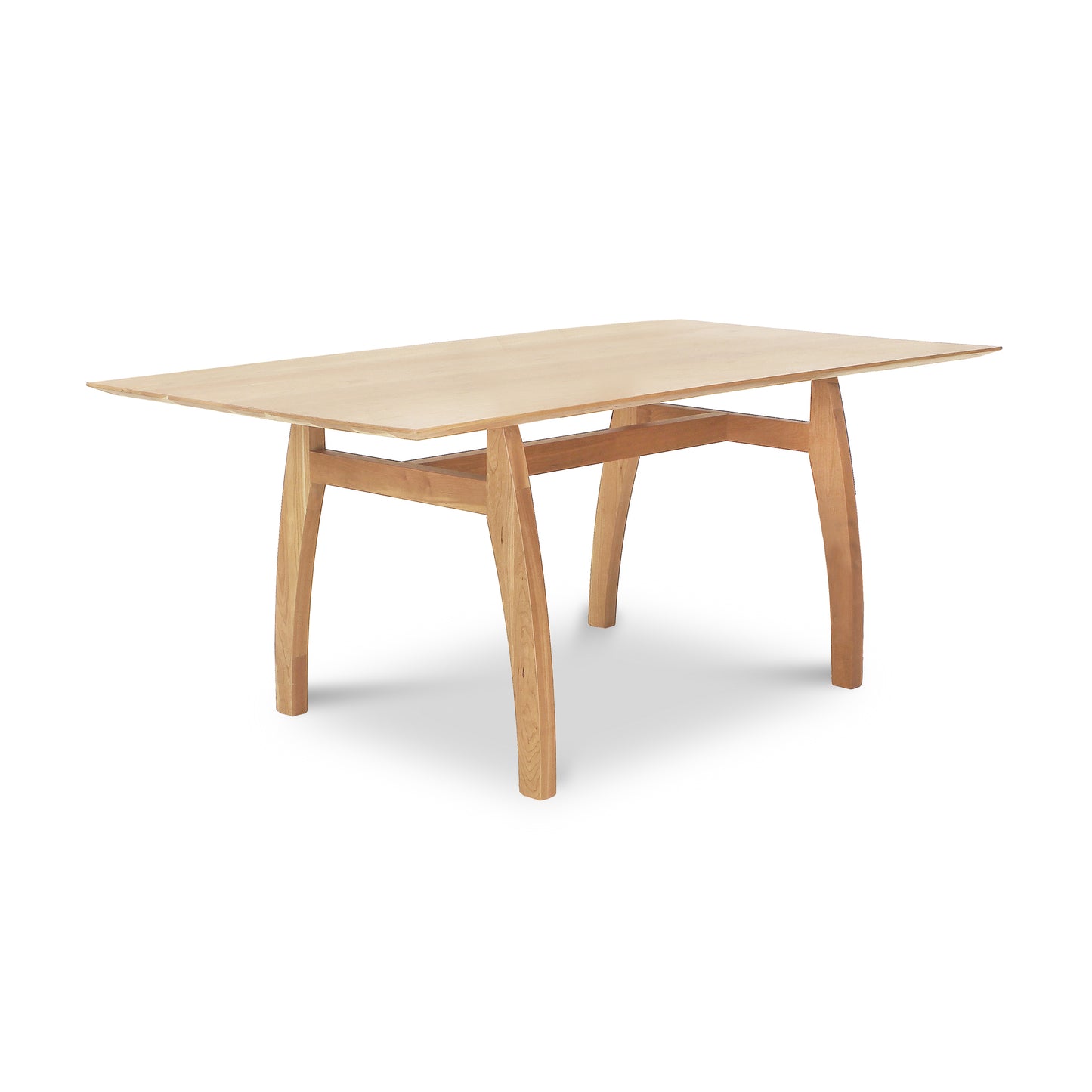 Vermont Modern Solid Top Trestle Table by Lyndon Furniture with light wood finish and distinctive curved legs, highlighting craftsmanship and modern design.