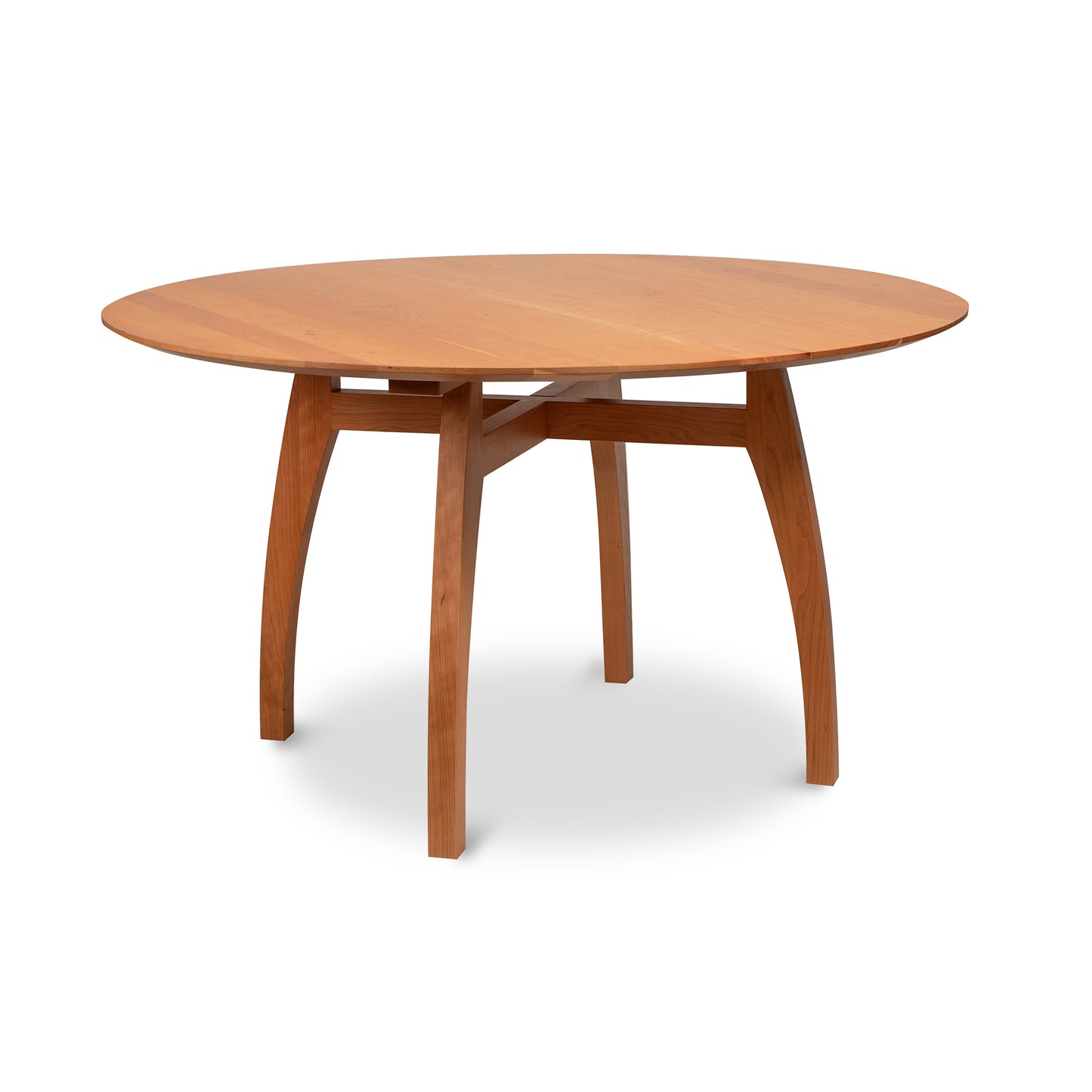 Lyndon Furniture Vermont Modern Round Solid Top Pedestal Table with four curved legs and natural wood grain detailing.
