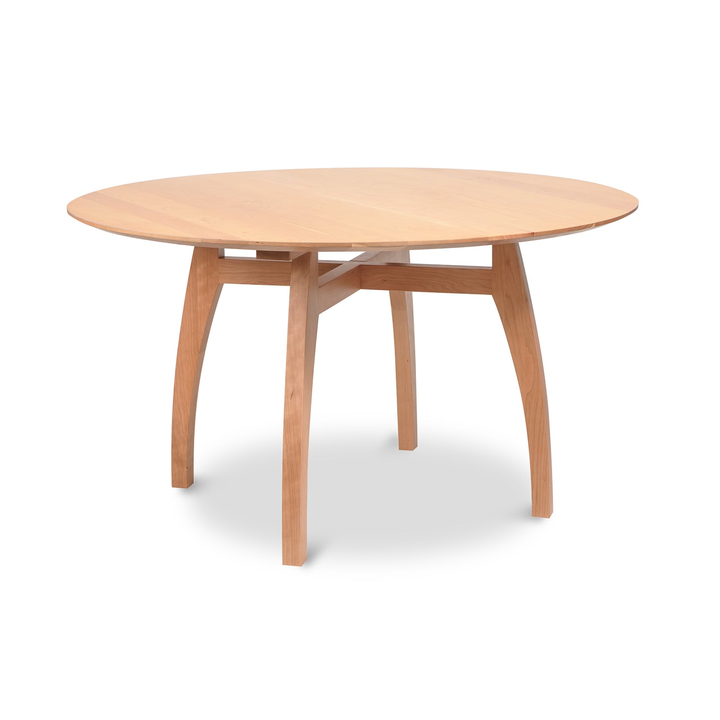 Lyndon Furniture Vermont Modern round pedestal table with solid wood top, light finish, and four elegantly curved legs.