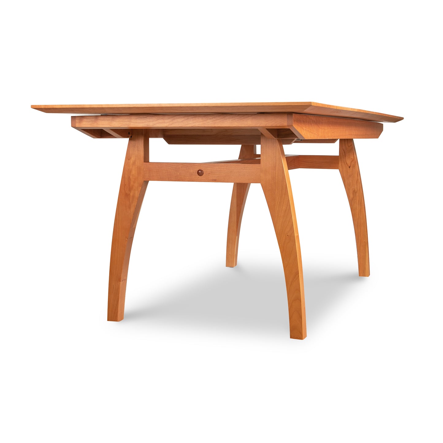 A high-end, handmade Vermont Modern Butterfly Extension Table from Lyndon Furniture with a wooden top and legs.