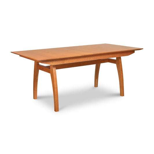A high-end Vermont Modern Butterfly Extension Table - Floor Model by Lyndon Furniture with a wooden top.