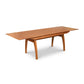 A high-end wooden Vermont Modern Butterfly Extension Table from Lyndon Furniture with a wooden top.