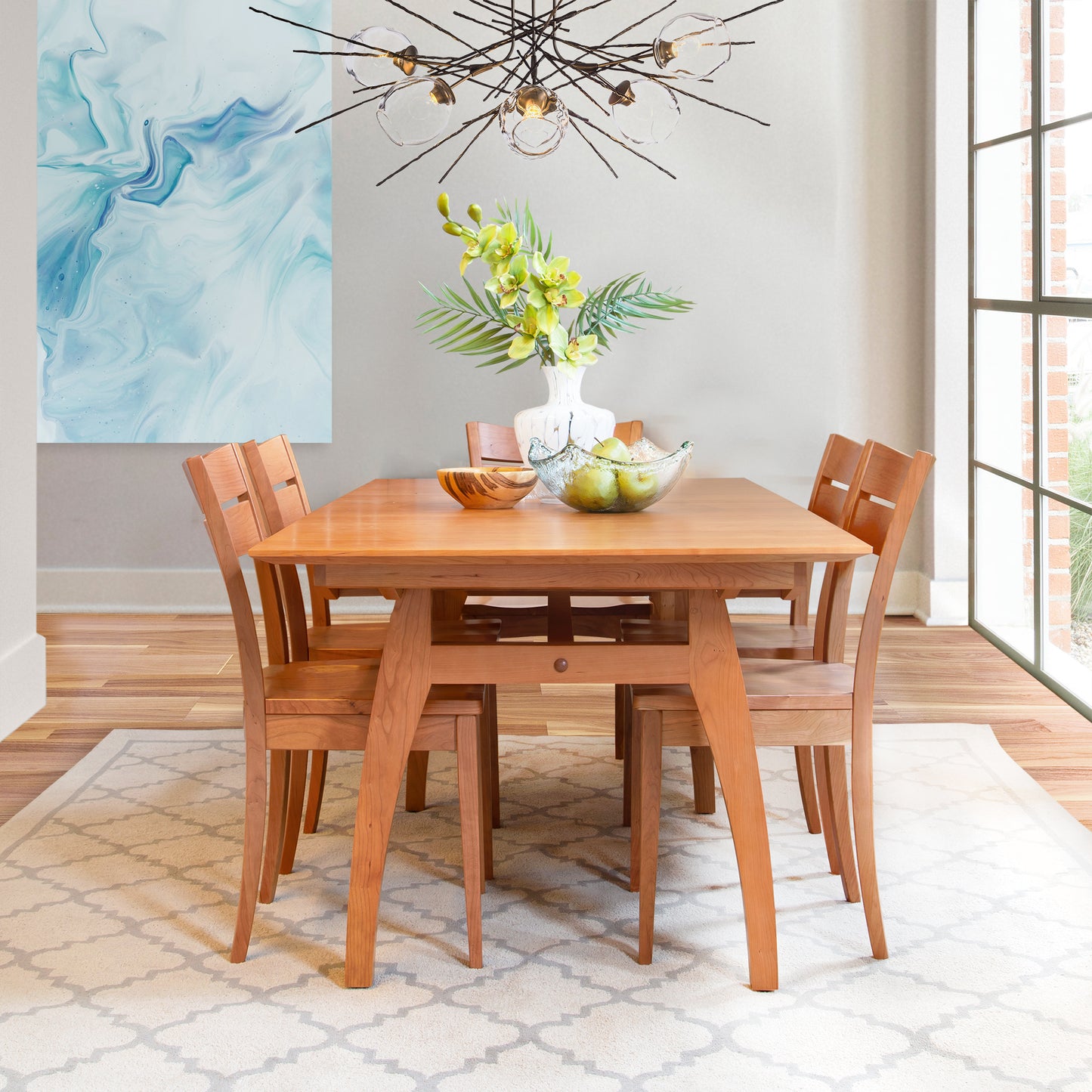 A high-end dining room with a Lyndon Furniture Vermont Modern Butterfly Extension Table and chairs.