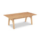 A handmade rectangular Lyndon Furniture Vermont Modern Trestle Coffee Table with a wooden top and legs.
