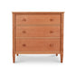 A Maple Corner Woodworks Vermont Shaker 3-Drawer Chest with three parallel drawers, each featuring a rounded knob. The furniture stands on four legs and is set against a white background.