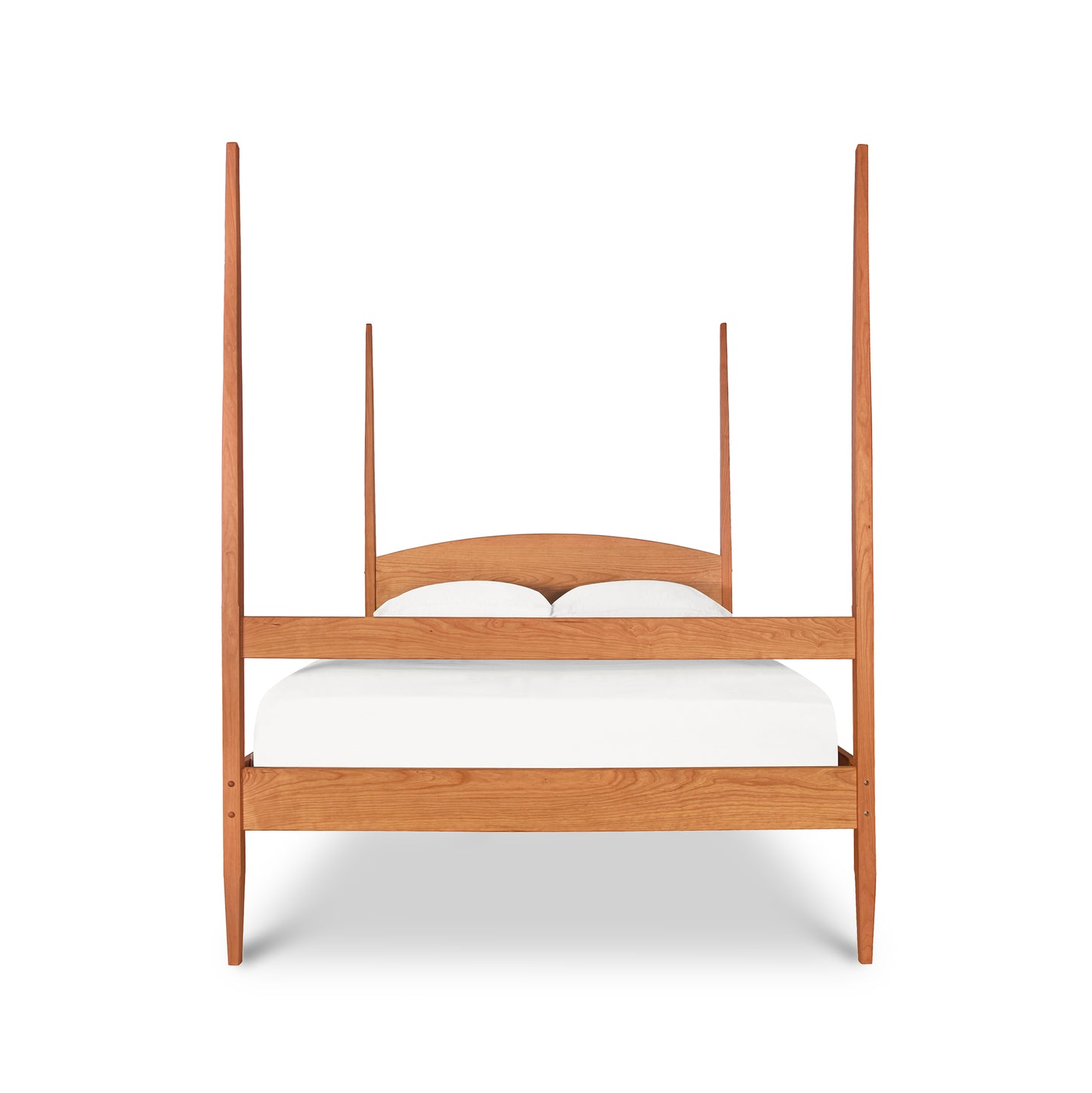 Vermont Shaker Four Poster Bed by Maple Corner Woodworks featuring a curved headboard and solid wood construction with a white mattress.