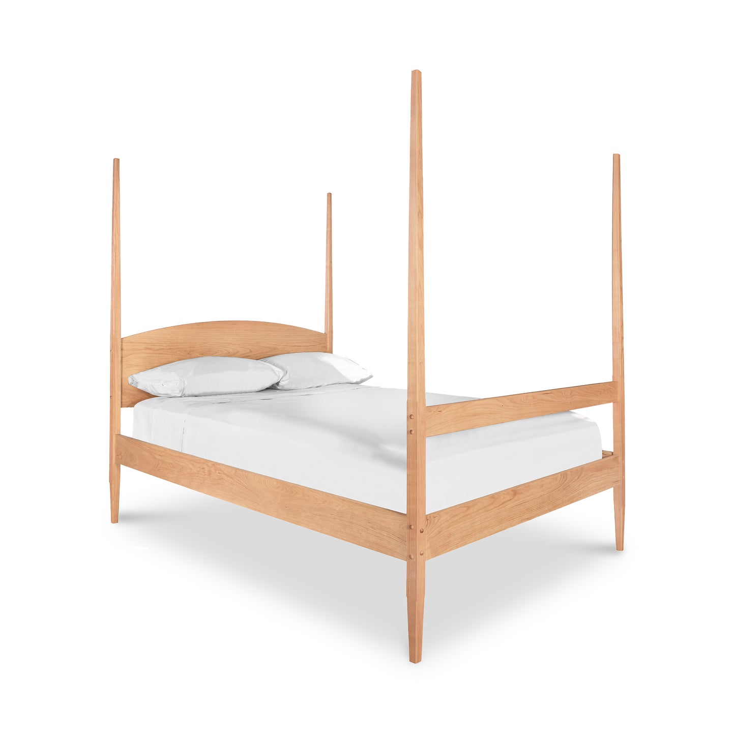 A minimalistic Vermont Shaker Four Poster Bed made of light wood, featuring a simple headboard and a white mattress with pillows, set against a plain white background. Brand: Maple Corner Woodworks.