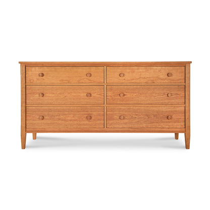 A Maple Corner Woodworks Vermont Shaker 6-Drawer Dresser with six drawers, arranged in two columns of three, featuring round knobs and slightly tapered legs, against a plain white background.
