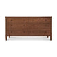 A Vermont Shaker 6-Drawer Dresser by Maple Corner Woodworks, featuring a symmetrical design and round knobs, isolated on a white background.