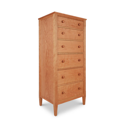 A tall wooden lingerie chest from the Maple Corner Woodworks Vermont Shaker Furniture Collection with six drawers, isolated on a white background.