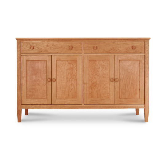 A Vermont Shaker Large 60" Sideboard from Maple Corner Woodworks with four doors and two drawers, isolated on a white background.