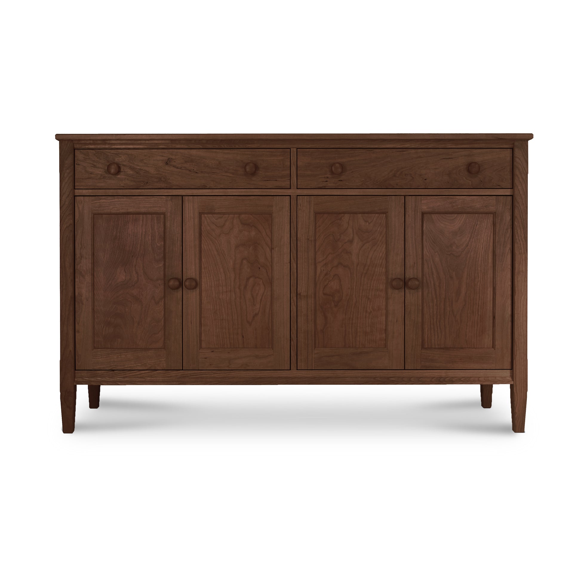A Vermont Shaker Large 60" Sideboard by Maple Corner Woodworks, with four doors and a single drawer, featuring a natural cherry finish and tapered legs, isolated on a white background.
