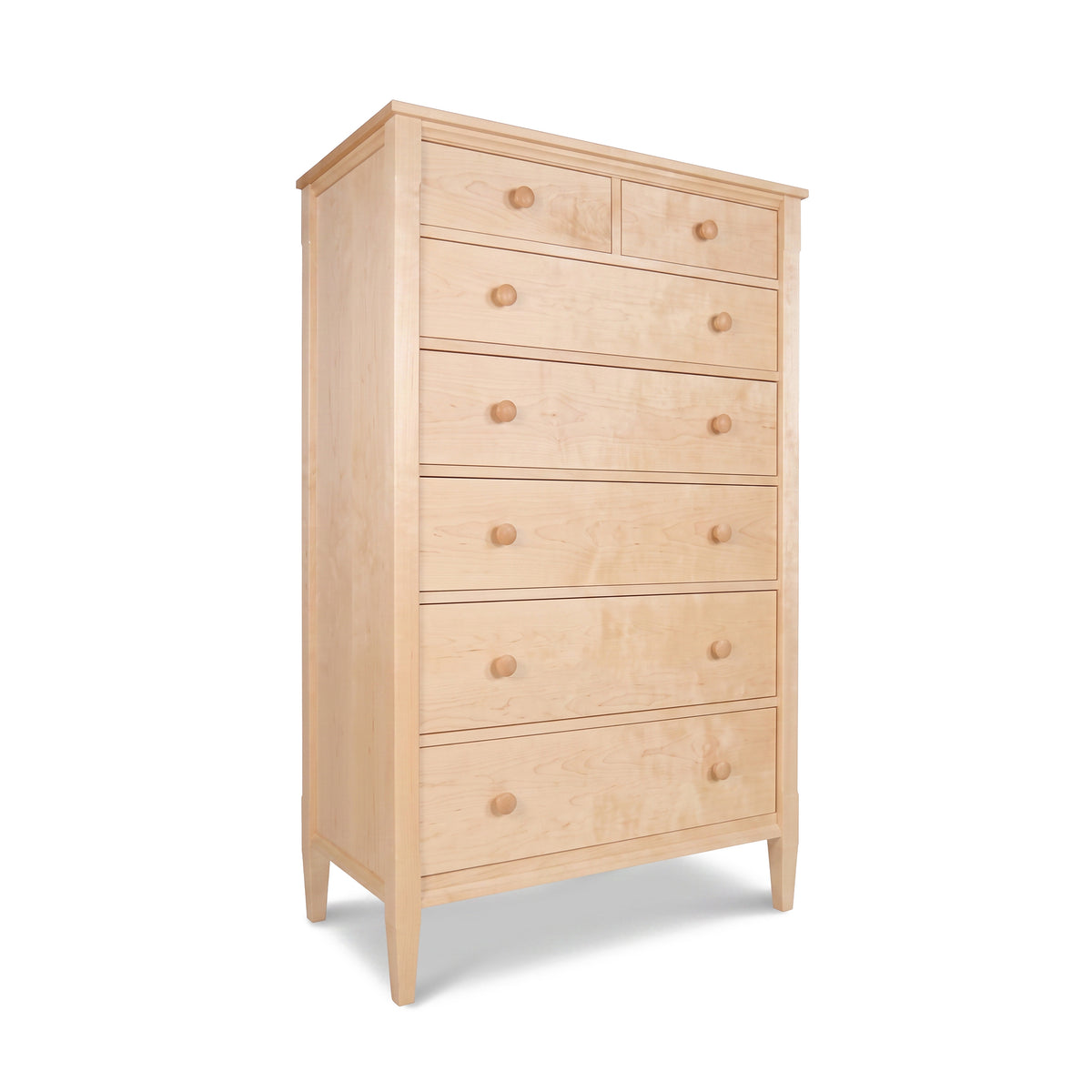 Vermont Shaker 7-Drawer Chest by Maple Corner Woodworks in light wood with round knobs and tapered legs, crafted in a timeless, classic style.