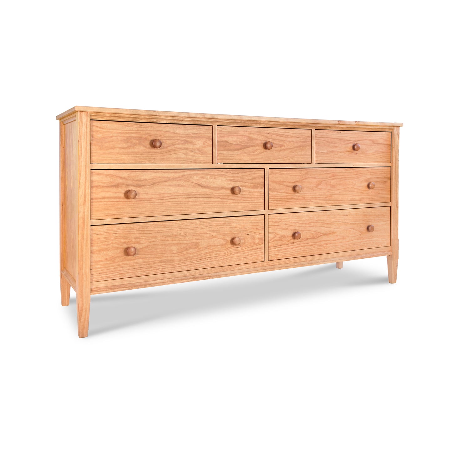 Vermont Shaker 7-Drawer Dresser by Maple Corner Woodworks, handcrafted from sustainable hardwood with round wooden knobs, shown in a natural finish.