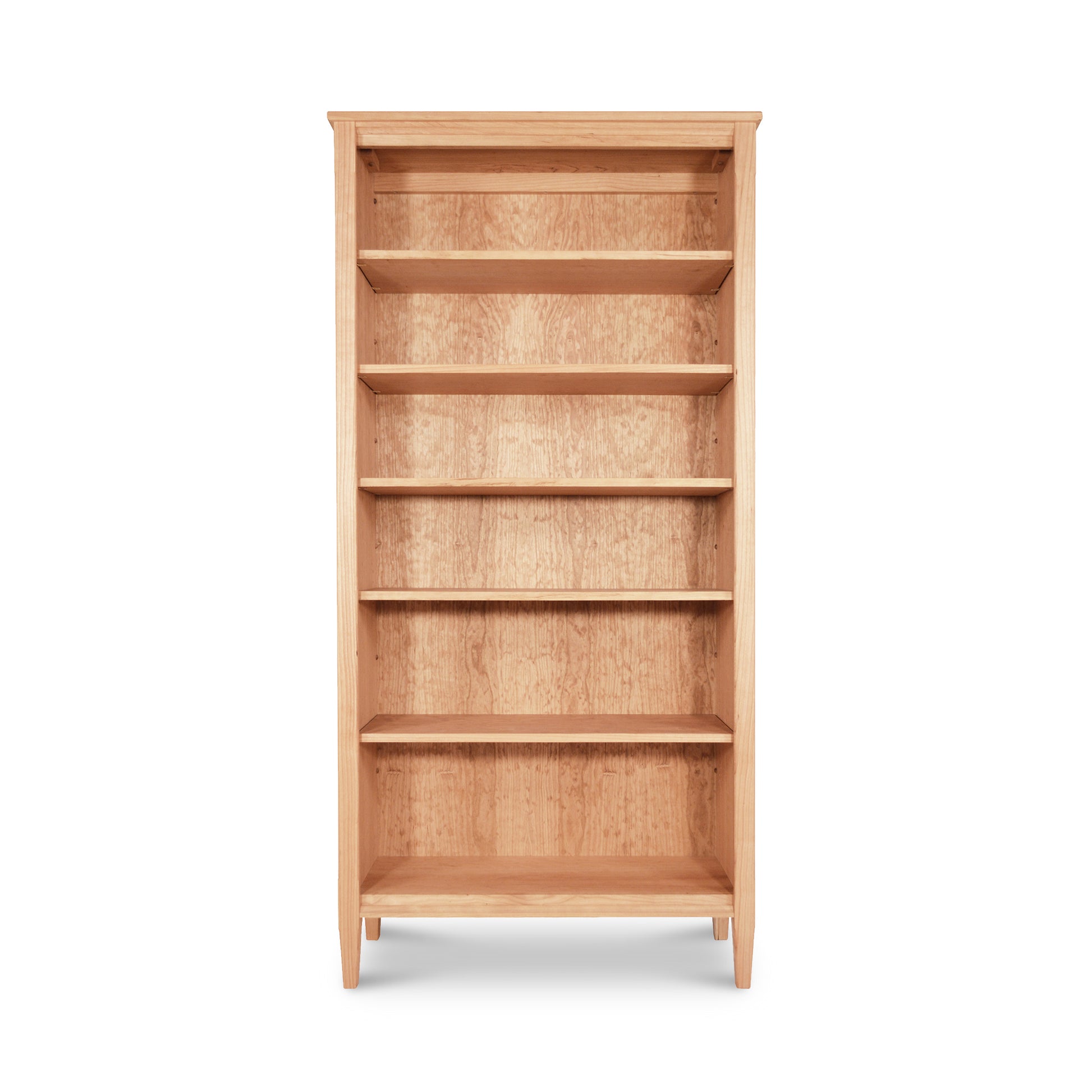 Vermont Shaker Bookcase by Maple Corner Woodworks, a tall wooden bookshelf with five shelves made from sustainably harvested hardwoods, shown empty against a white background. Part of the Vermont Shaker Furniture Collection.