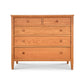 A Vermont Shaker Extra Wide Chest from Maple Corner Woodworks, with five drawers, featuring a natural cherry finish and round knobs, isolated on a white background.