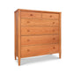A Maple Corner Woodworks Vermont Shaker Extra Wide Chest crafted from natural cherry, featuring five drawers and standing on four legs, set against a white background.