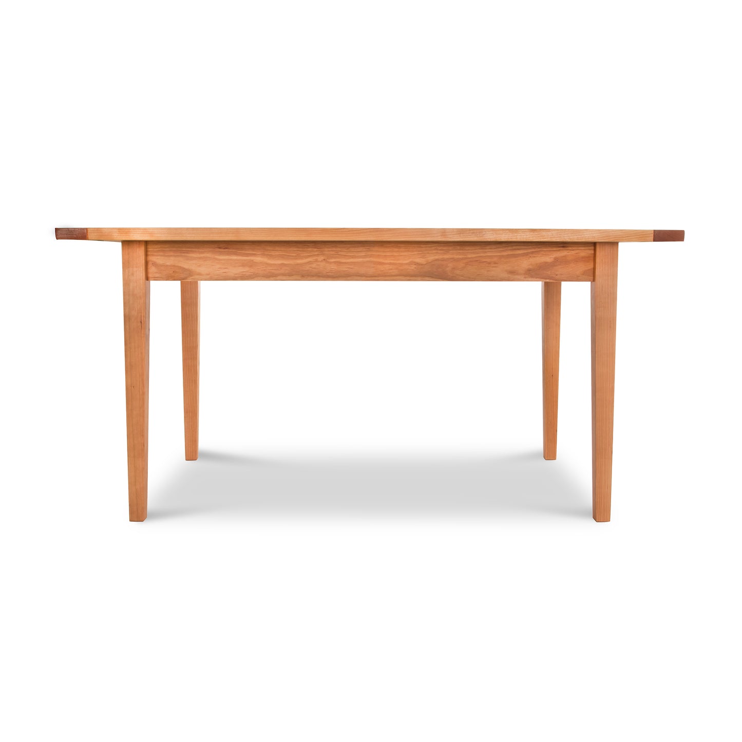 A Maple Corner Woodworks Vermont Shaker Harvest Extension Dining Table with a smooth top and four straight legs, isolated on a white background.