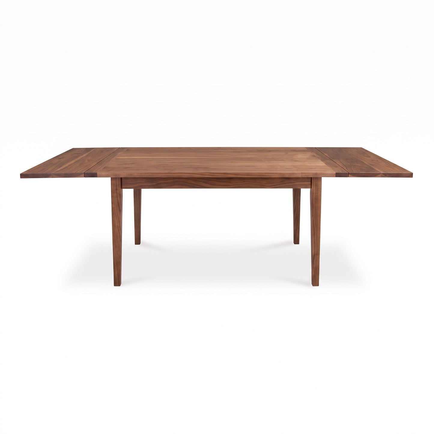 Vermont Shaker Harvest Extension Dining Table by Maple Corner Woodworks with four legs and extension leaves highlighted against a plain background.