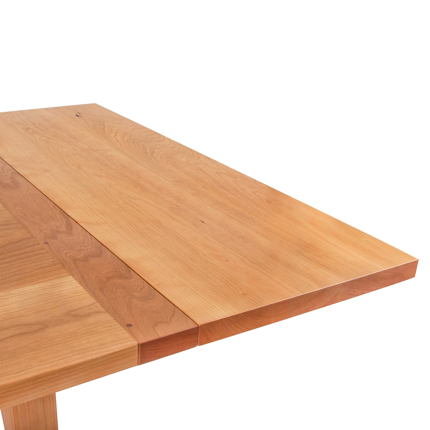 Vermont Shaker Harvest Extension Dining Table by Maple Corner Woodworks, showcasing an extended leaf and light wood grain with a smooth finish, handcrafted from sustainably harvested wood.