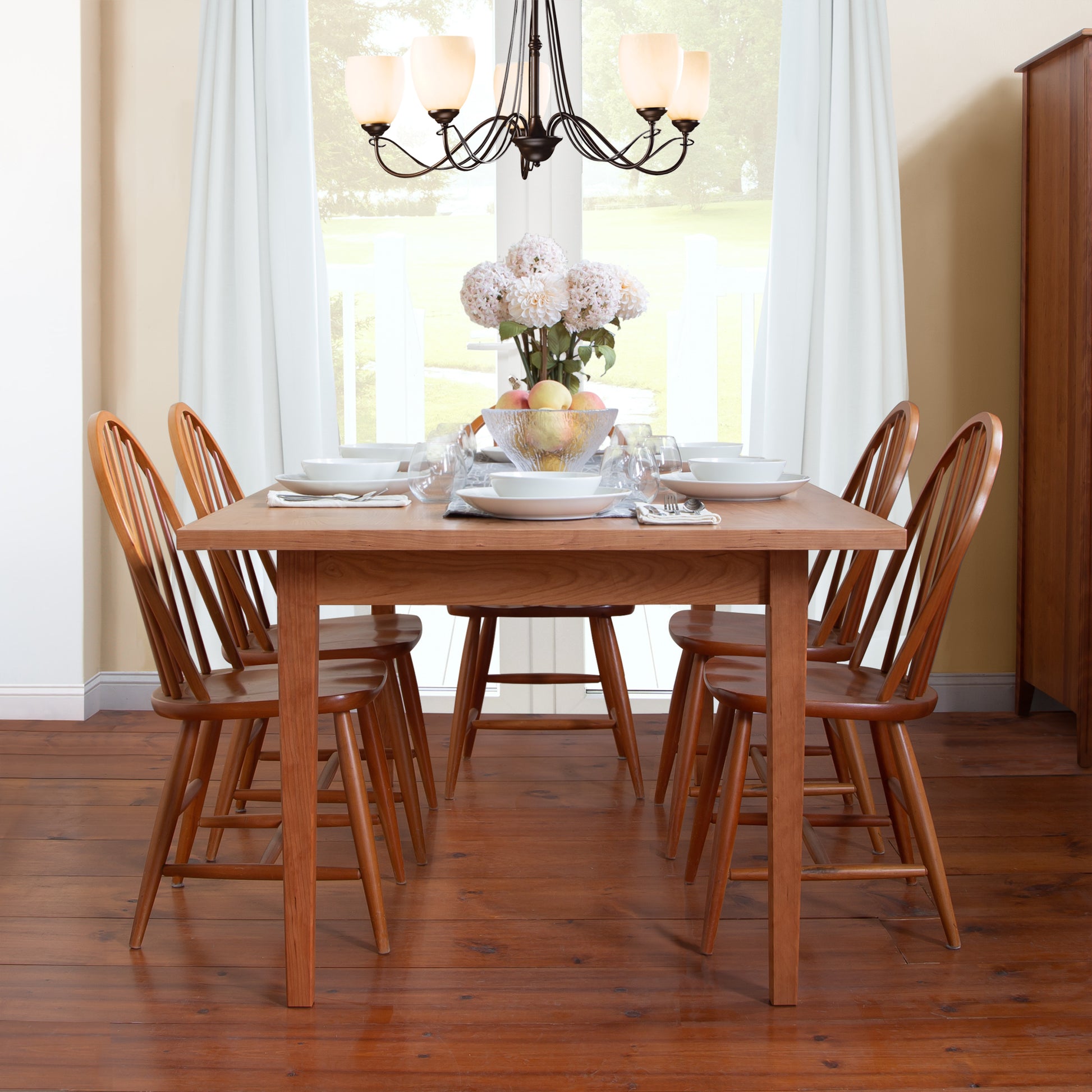 Vermont Shaker Harvest Extension Dining Table with 6 chairs, made by Maple Corner Woodworks, showcases fine craftsmanship in eco-friendly wood.