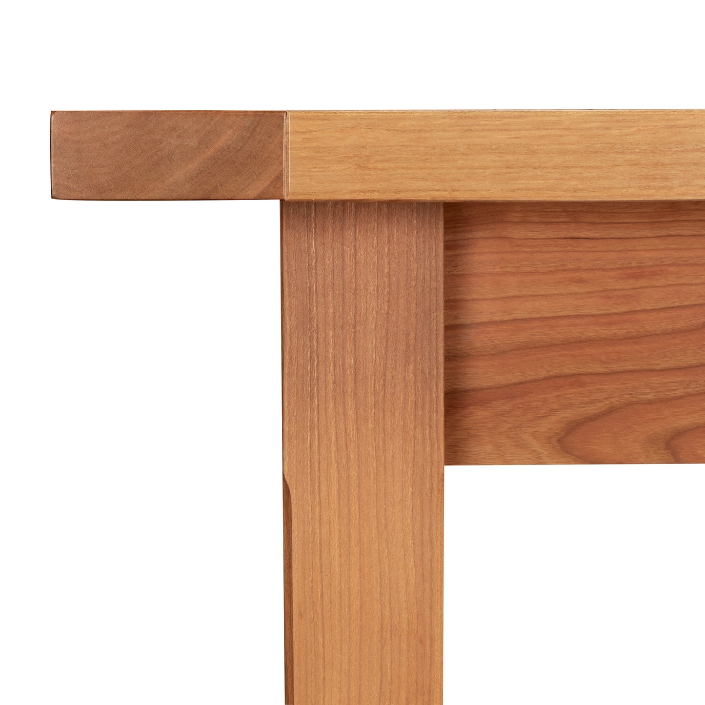 Vermont Shaker Solid Top Harvest Table corner by Maple Corner Woodworks, showcasing traditional style with simple lines and rich natural cherry wood grain texture.