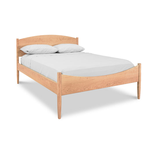 Vermont Shaker Moon Bed with natural wooden finish and minimalist design by Maple Corner Woodworks.