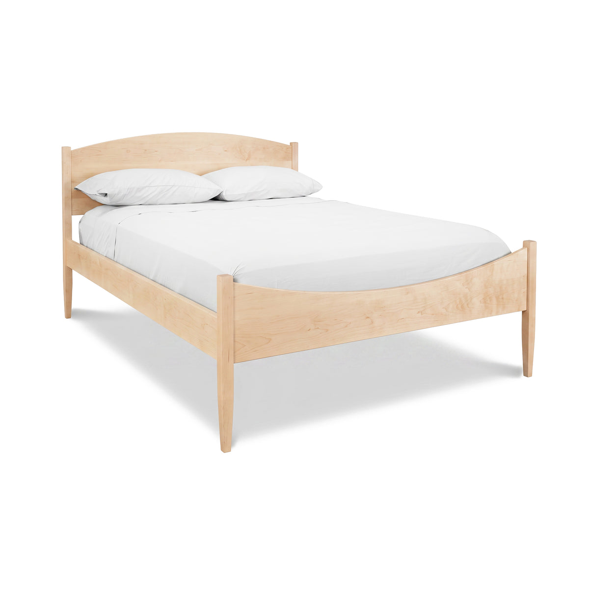 Maple Corner Woodworks Vermont Shaker Moon Bed in light finish, featuring handcrafted detail, white bedding, and two pillows.