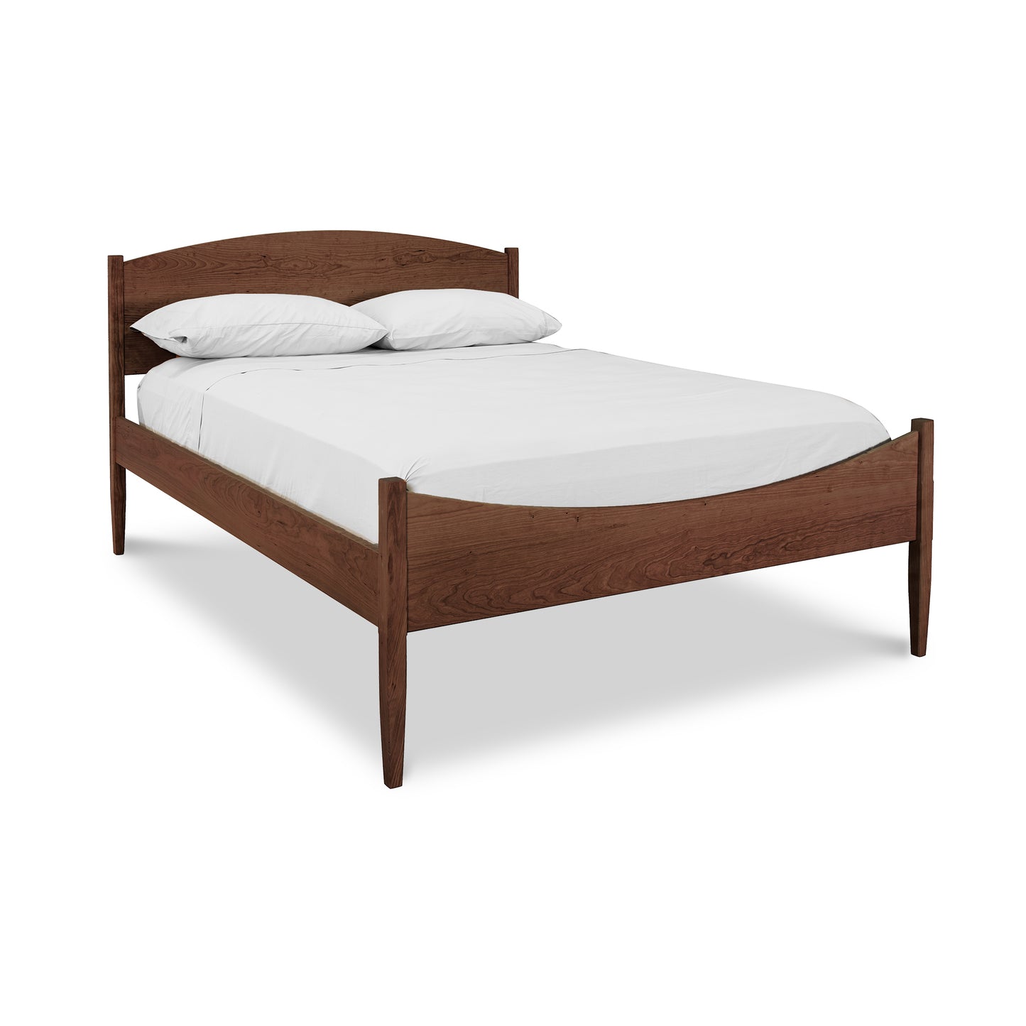 A simple Maple Corner Woodworks Vermont Shaker Moon Bed wooden bed frame with a headboard and footboard, finished in dark brown, supporting a white mattress with two white pillows, displayed against a plain white background.